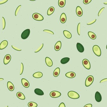 Seamless pattern of avocado halves with pits, whole avocados and slices on sage green