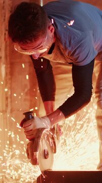 A skilled craftsman operates a power tool to cut through metal, emitting sparks in a dynamic scene showcasing precision and craftsmanship in action.