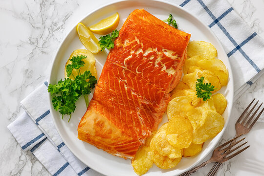 Canadian hot-smoked salmon piece with potato chips