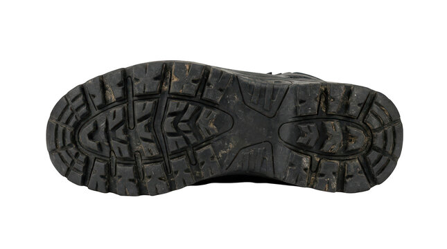 Detailed view of a rugged outdoor boot sole with deep treads for traction and durability isolated on transparent background