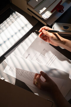 Comparing Financial Documents at a Desk