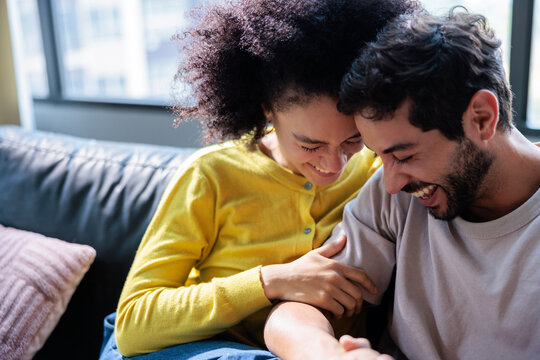 Man and woman sharing moments of love at home