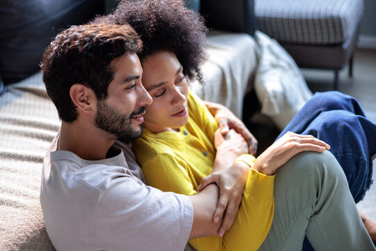 Couple in love rests on the floor