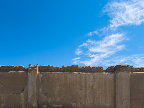 Ancient Stone and Mud-Brick Wall Against Blue Sky