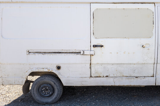 Worn White Panel Van Side View in Kyrgyzstan
