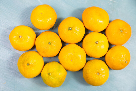 Mandarin, tangerine or clementine citrus fruit, juicy ripe fruits, healthy organic food, vitamin booster, fitness and lifestyle concept, harvest in winter season