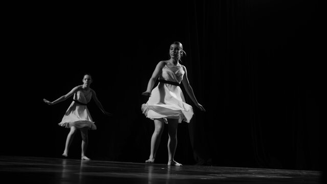 Contemporary Ballet Duo Performing an Expressive Dance on Stage