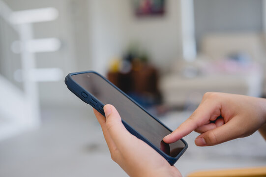 Social media marketing concept. Woman hand using smartphone typing, chatting conversation in chat box icons pop up