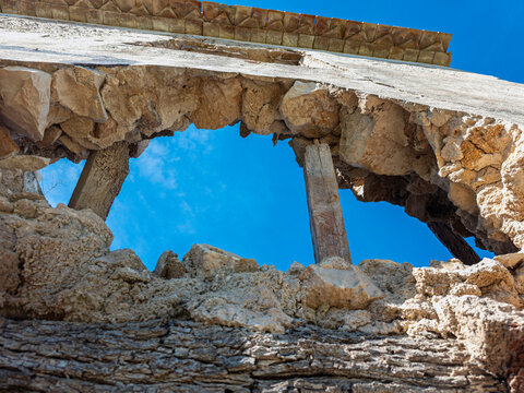 Low Angle View of a Damaged Stone Wall with Hole Framing Bright