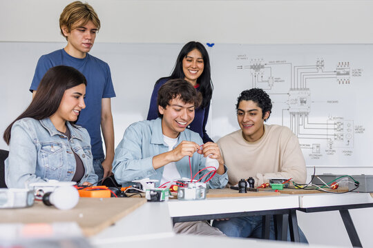 group of latin american students in an electricity class or electrical circuits at university in Mexico
