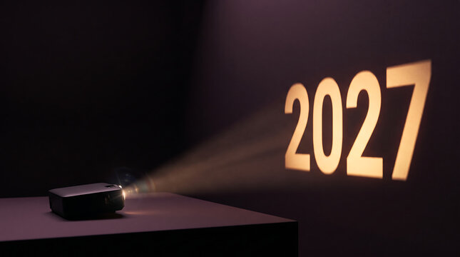 Projected year 2027 shining from a small portable projector