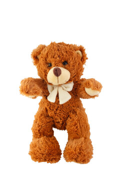 Front view of classic brown stuffed teddy bear plush toy wearing white bow tie standing isolated white background