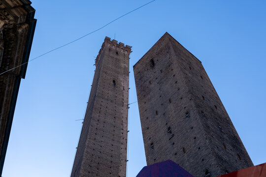 Low angle view of the Two Towers, Asinelli and Garisenda, against a clear blue sky in Bologna, Italy