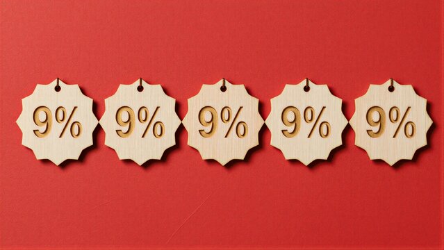 Five wooden 9% discount tags arranged neatly on a vibrant red background.
