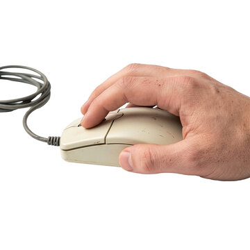 Hand clicking a vintage computer mouse