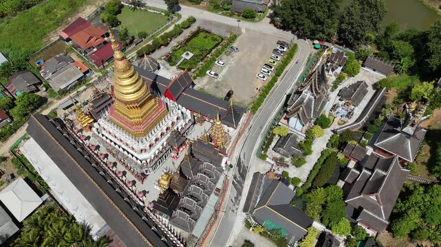Aerial view of large beautiful pagoda situated at Wat Phra That Si Wiang Mun temple in Mae Chan district of Chiang Rai province of Thailand. This temple is combining Lanna and Tai Yai styles.