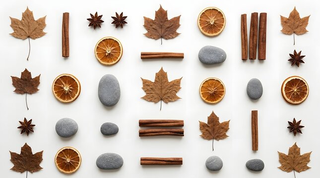 Autumn flat lay composition with dried maple leaves, cinnamon sticks, orange slices and stones