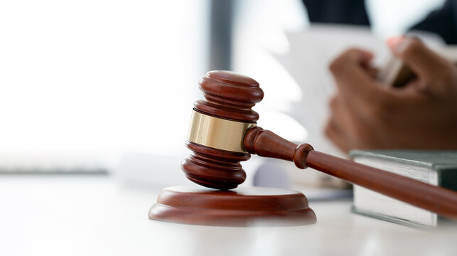udge Gavel and Law Book on Desk in Courtroom or Legal Office
