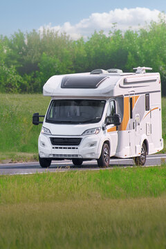 Comfortable journey in a white camper van during holiday