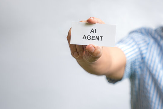 Businessman holding a white card with note - AI Agent
