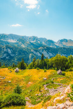 Alpine hiking trail from Prijevor in Bosnia to Trnovacko Lake in Montenegro, dramatic Dinaric Alps in Sutjeska park landscapes and crystal clear turquoise water.