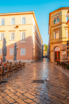 Zadar, Croatia. Old town street of Zadar with the Church of St. Donatus and the bell tower of the Cathedral of St. Anastasia at sunset.