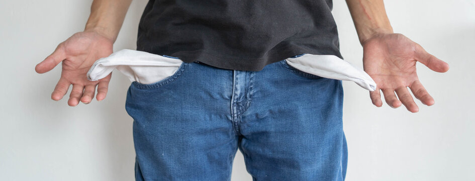 bankruptcy economic financial concept. Person open his empty wallet without money to pay debt in payday.