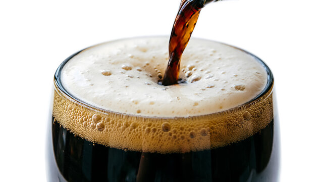 Macro of dark stout beer cascading in a glass, thick creamy nitrogen bubbles settling, on a white background.