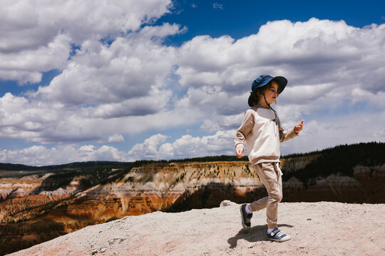 Child exploring a beautiful canyon on a sunny day