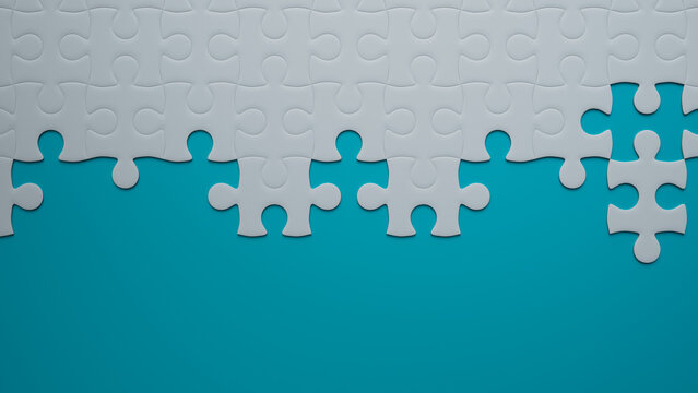 Partially Completed Teal and White Jigsaw Puzzle Wallpaper with copy-space. Development Concept.