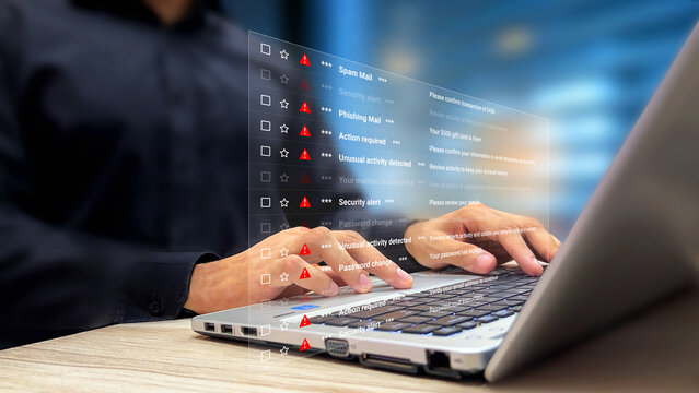 Person scrolling spam emails and phishing links on a laptop virtual screen. Spam mail notification, phishing emails, unusual activity, inbox at risk, cyber threats, fraud detection, security alerts