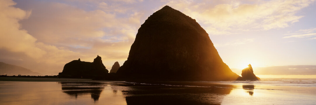 Haystack rock silhouette at sunset on cannon beach oregon coast