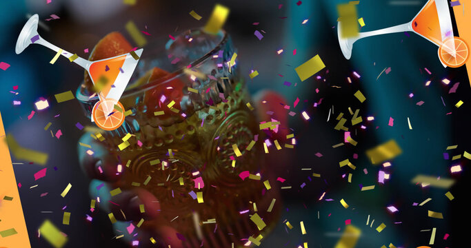 Image of confetti and drink icons over hand holding drink