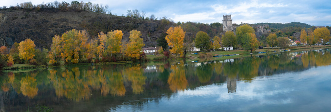Autumn panorama of Danube river with reflection of historic Weitenegg castle ruin in Lower Austria