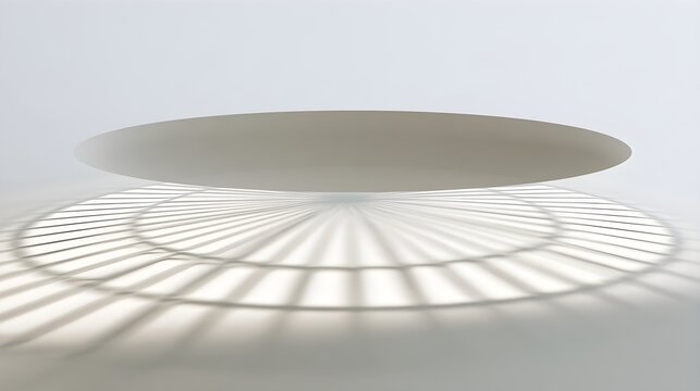 Circular skylight shadow on a white surface