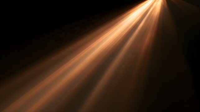 Golden light rays shining through darkness