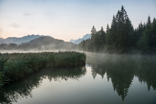 Lake Geroldsee sunrise with mist and reflections, Germany