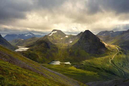 Mountains and waterfall in valley at Skarasalen Fjord Norway
