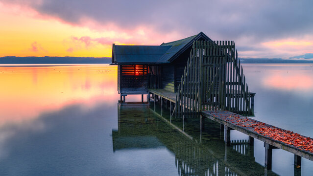 Boat hut at sunrise on Lake Starnberg in Bavaria, Germany