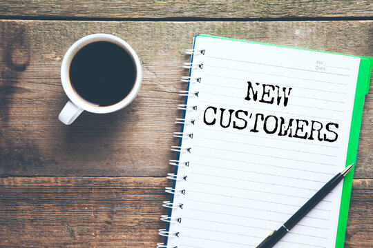 NEW CUSTOMERS text on paper