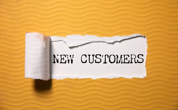 NEW CUSTOMERS text on paper
