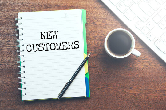 NEW CUSTOMERS text on paper