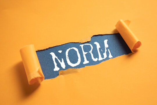 NORM word written on paper