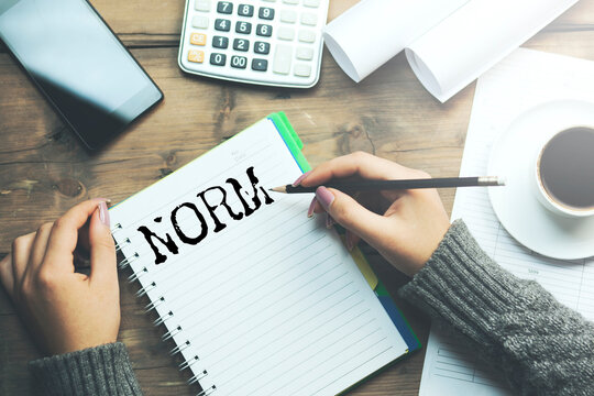NORM word written on paper