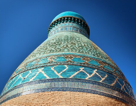 chor minor tower detail in bukhara showing turquoise tilework and dome against clear blue sky ideal for travel publications and architectural reference materials