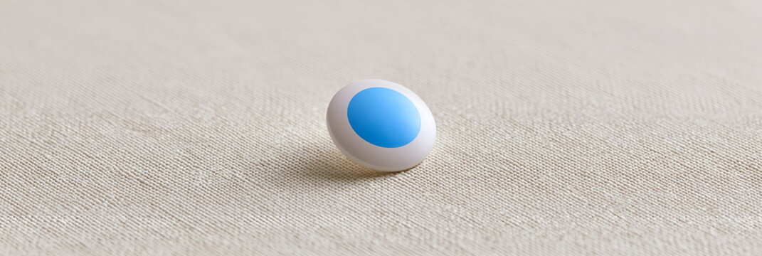 Single Blue and White Bead: A solitary bead with a vibrant blue center and white outer casing rests on a textured surface, suggesting simplicity and elegance.