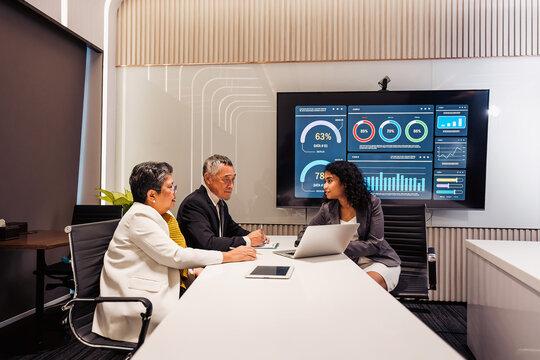 Business team reviews analytics in a modern conference room