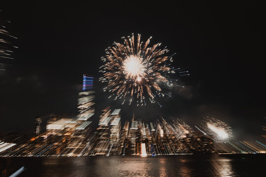 Firework Burst Above Manhattan Waterfront at Night
