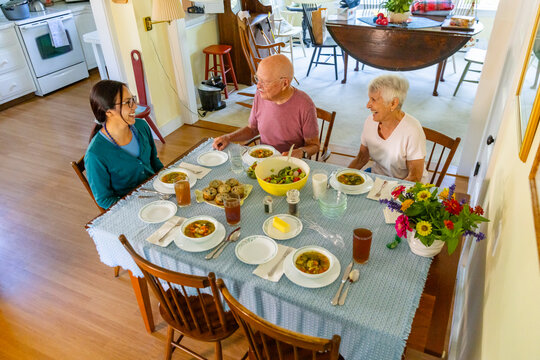 Senior Caregiver couple enjoy meal together