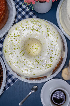 Brazilian bolo de limao - lemon cake with white icing and coffee